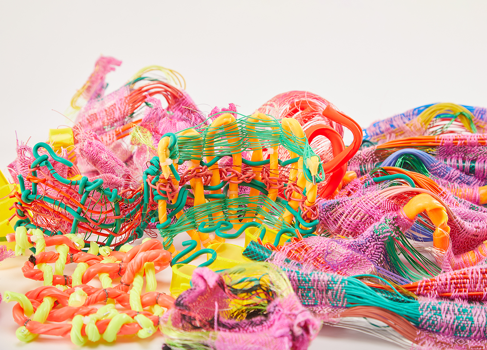 Student work by Rosie Marden. Colourful experimental woven fabrics made with unusual materials