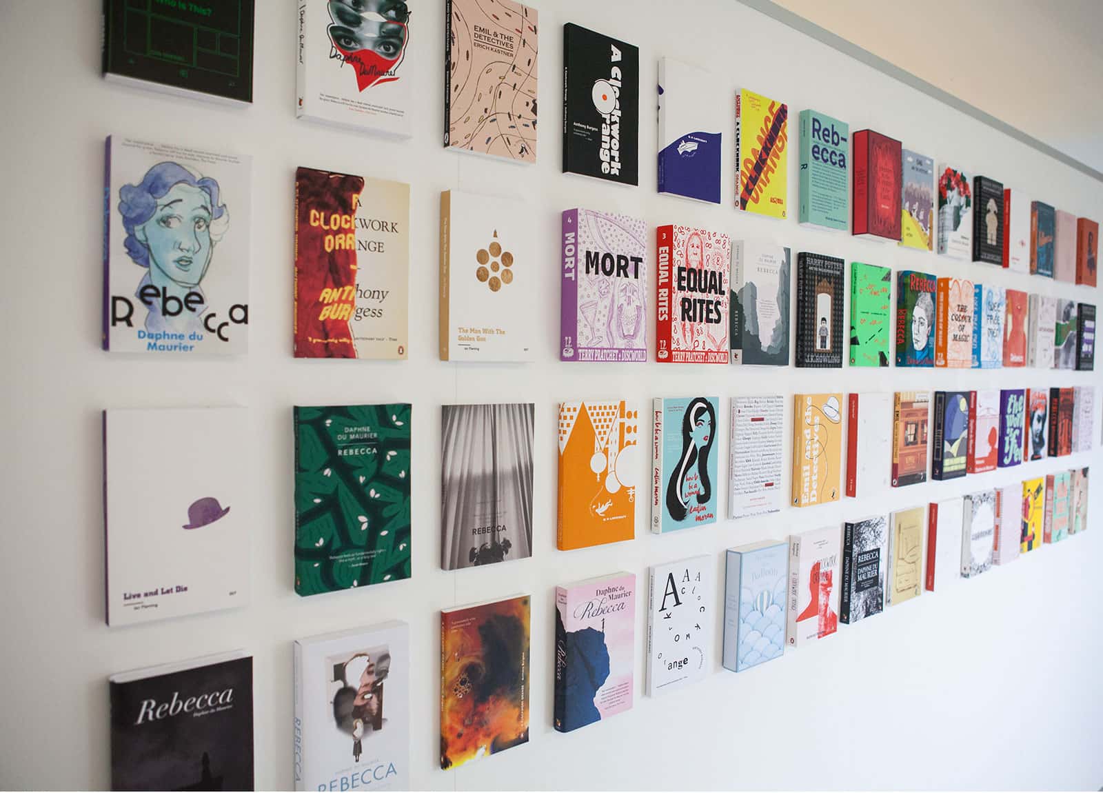 Image of designed publications mounted on a wall