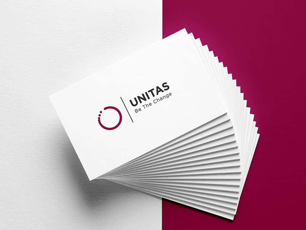 Business cards for 'Unitas' with white card stock, red logo graphic on the ledt, and 'Unitas be the change' in dark grey sans serif type on the right