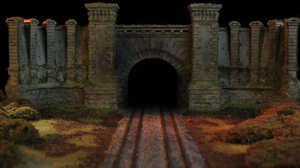 Created environment with the entrance to a stone railway tunnel