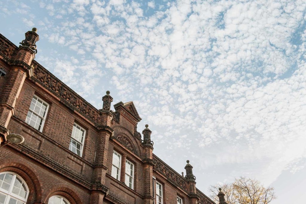 photo of Norwich University of the Arts St Georges building on a backdrop of clouds