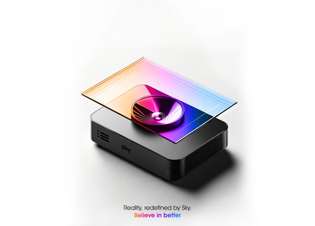 A sleek black projector with a colourful light beam forms a holographic screen above it, echoing the innovation taught in our UX design course. The text below reads, "Reality, redefined by Sky. Believe in better.