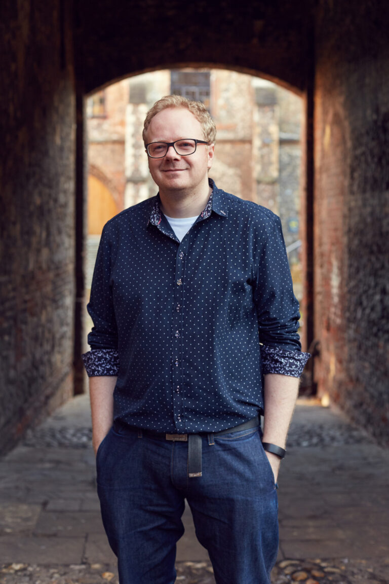 Ben Saulter stands in the alleyway at the Norwich University of the Arts East Garth Building