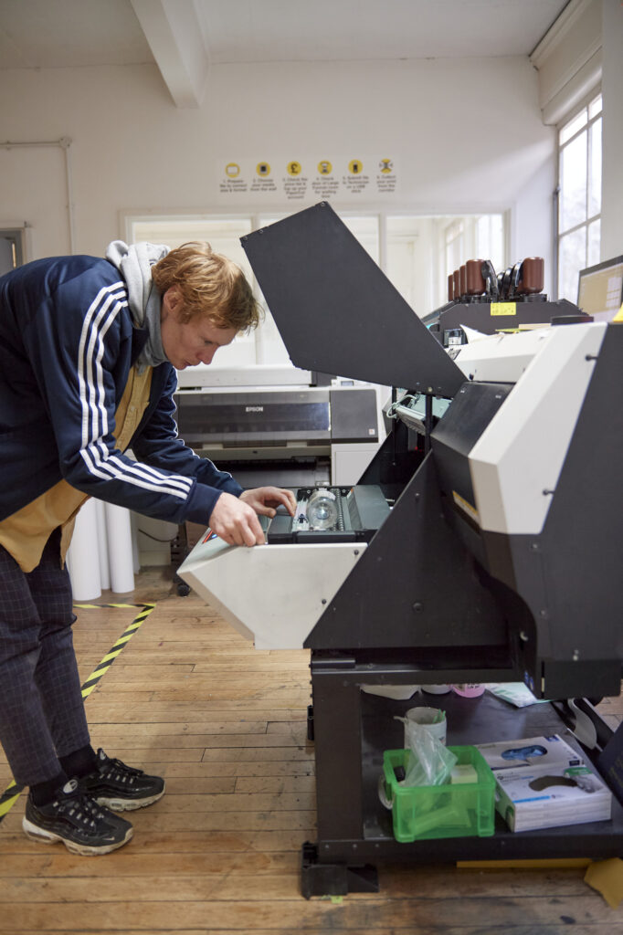 Students and staff using UV printer