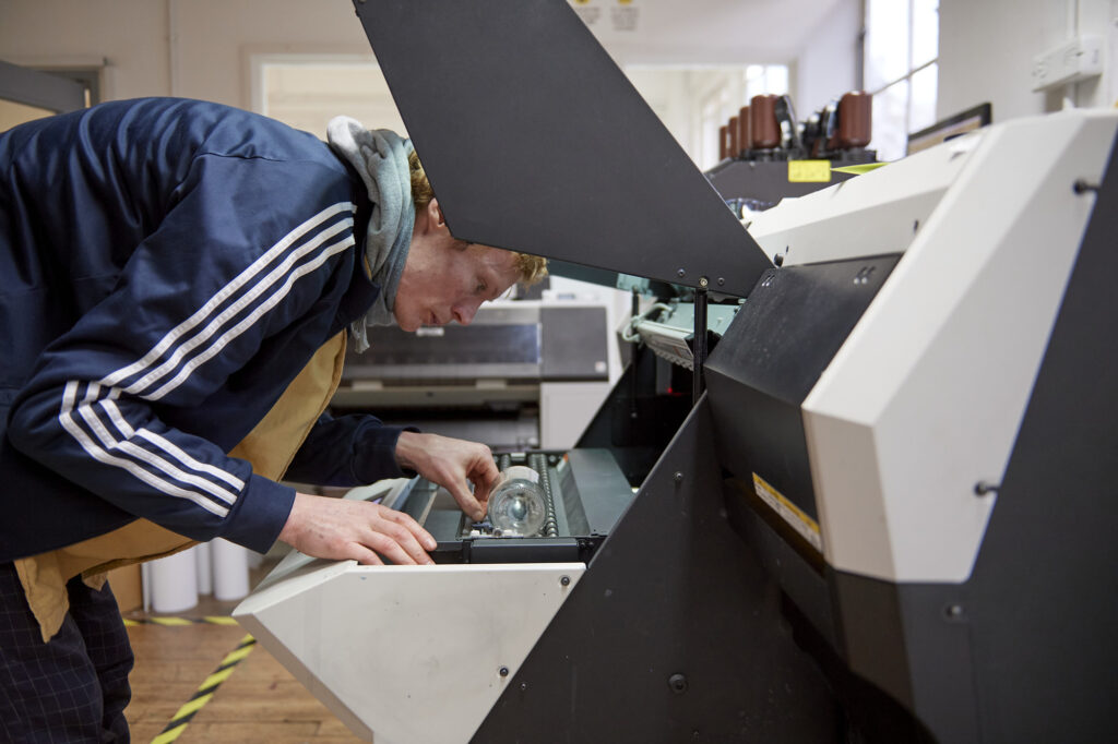 Students and staff using UV printer