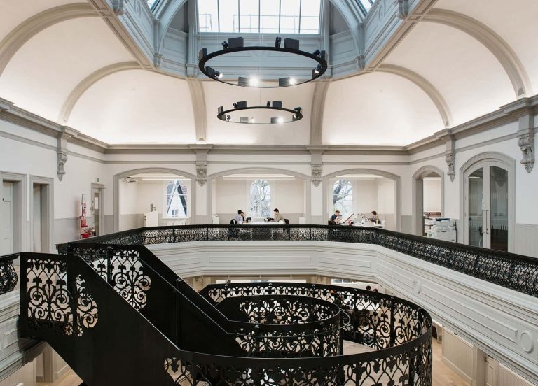 Image of the internal room of Norwich University of the Arts's Architecture building including a round staircase