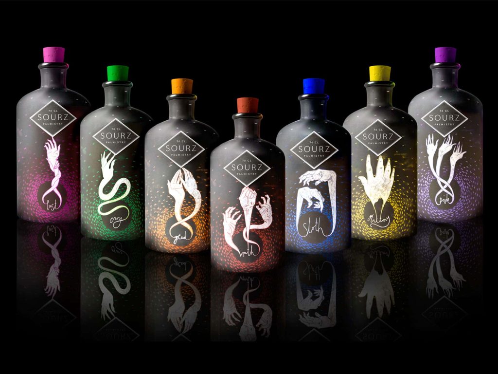 Image of designed sour shots bottles featuring illustrations of snakes and bright colours