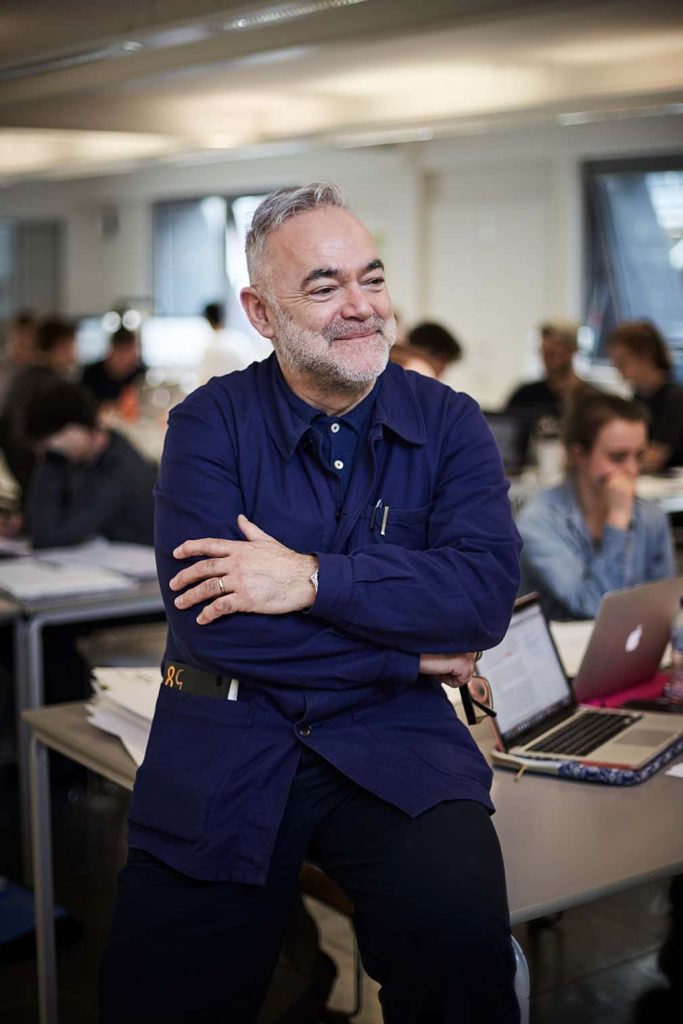 Phil Carter, sits in the Graphics studio at Norwich University of the Arts