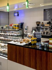 Cafe Norwich University of the Arts at Norwich University of the Arts in the St Andrews House building showing cakes, pastries and various food.