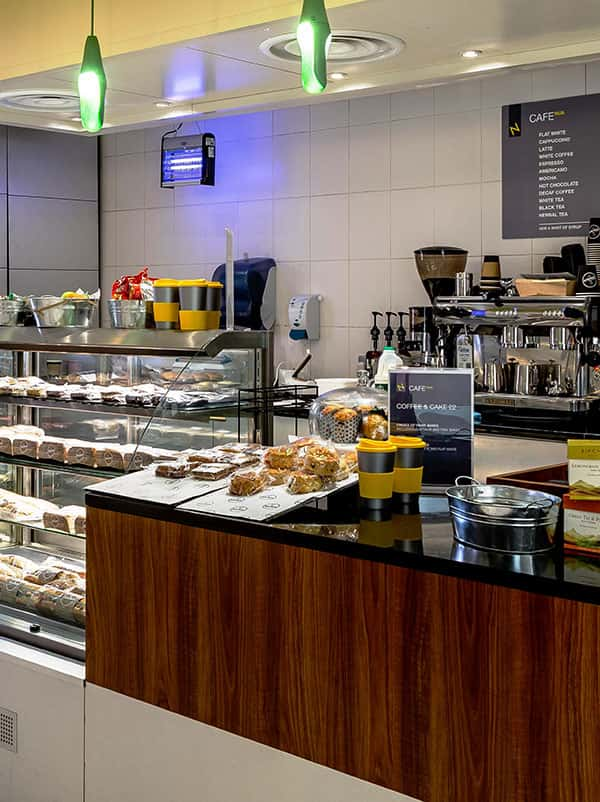 Cafe Norwich University of the Arts at Norwich University of the Arts in the St Andrews House building showing cakes, pastries and various food.