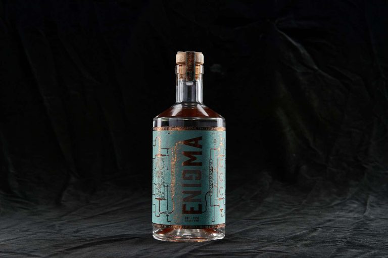 Designed gin bottle with the words 'Enigma' on by BA Graphic Design graduate Tom Baines