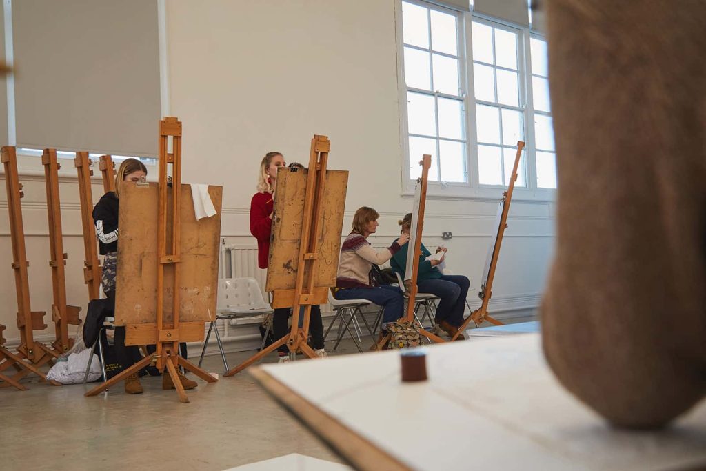 Students work on easels in Munnings Drawings Studio at Norwich University of the Arts