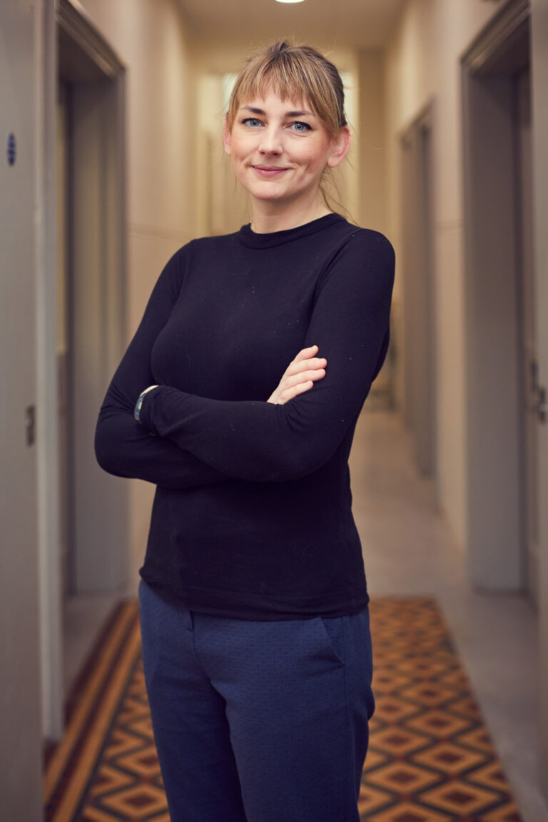 Erica Horton, Lecturer in Film and Moving Image Production at Norwich University of the Arts stands outside the Sir John Hurt film studio.