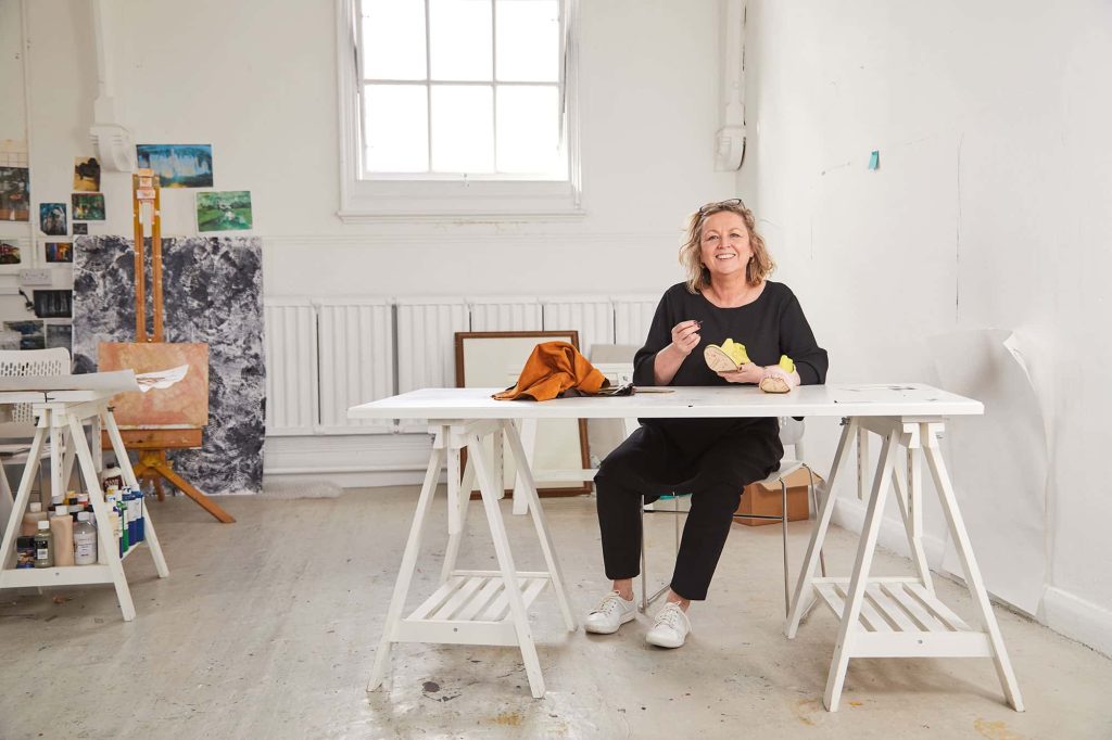 Marie Brennan, Head of postgraduate study at Norwich University of the Arts sits in the MA Fine Art studio with her own work