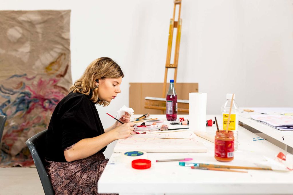 Fine Art student working on creative work in fine art studio