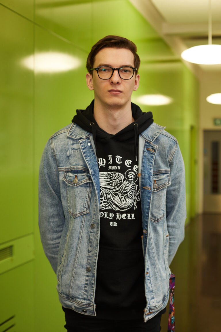 BA Animation and Visual Effects Lecturer Joseph Rowell standing in front of green wall at Norwich University of the Arts