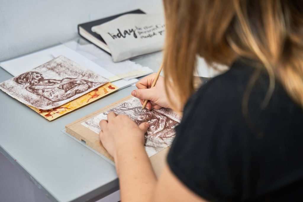 BA Fine Art student works on drawing in the fine art studio at Norwich University of the Arts