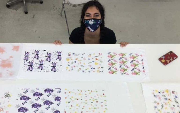 BA (Hons) Fashion student Cassidy El Fazazi with her Oasis collaboration prints featuring watercolour floral details and insects