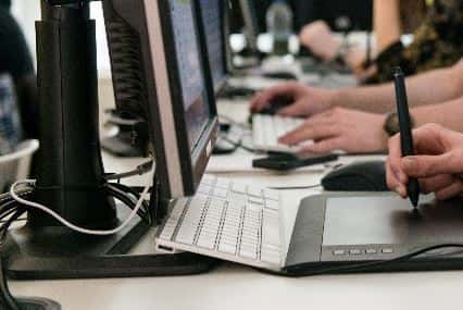 A person writing on a computer