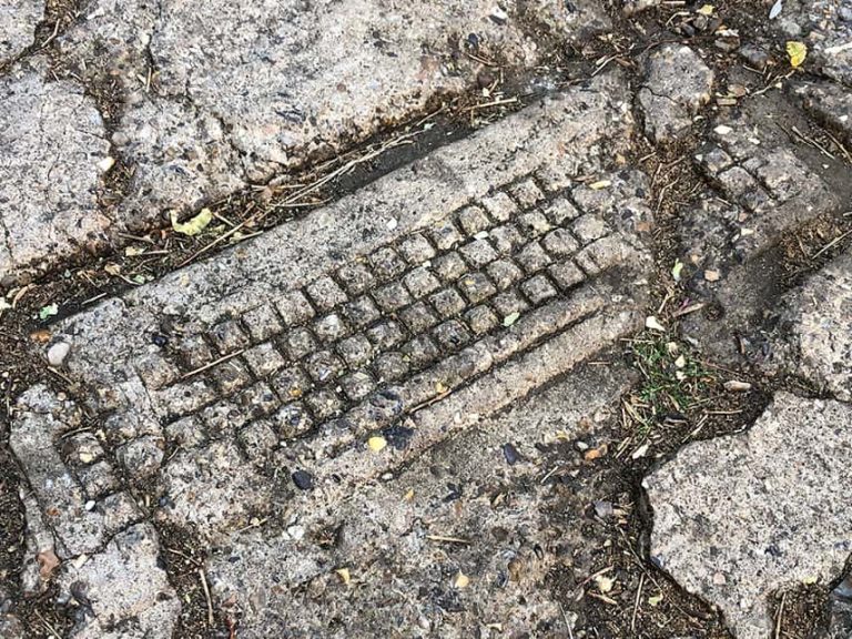 Image of keyboard embedded into pavement on Elm Hill