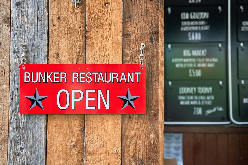 Image showing sign at fish and chip shop that reads " Bunker restaurant open"