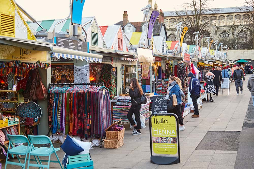 Image of Norwich market with people visiting stalls