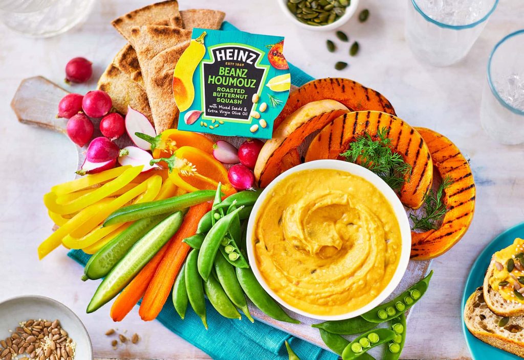 Photography of Heinz products on plates, including vegetables and hummus