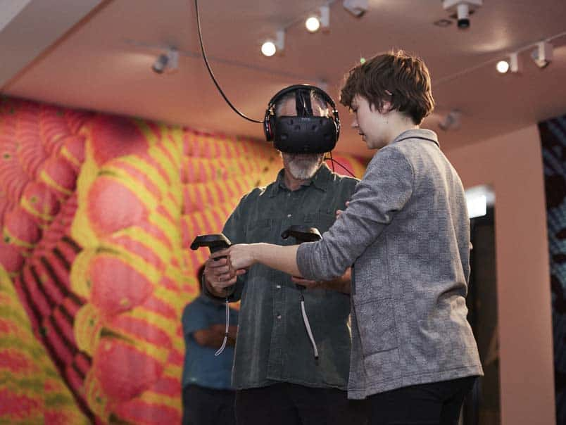 Image of two people using a VR headset