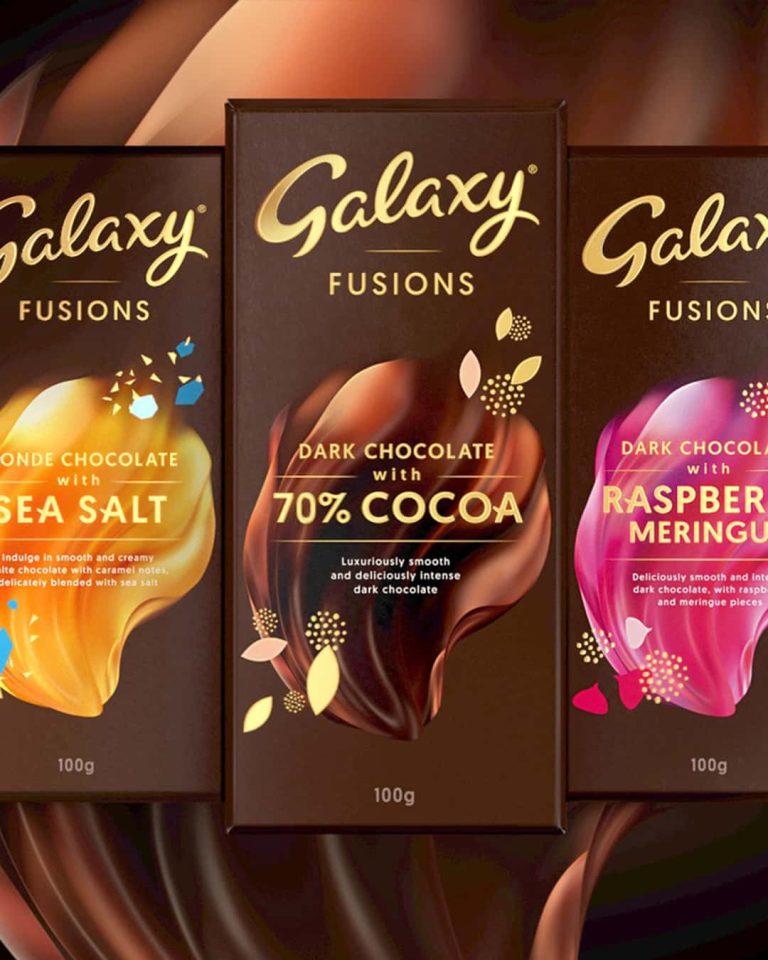 Three Galaxy chocolate bars wrapped in branded packaging. The packaging is brown with gold foil lettering.