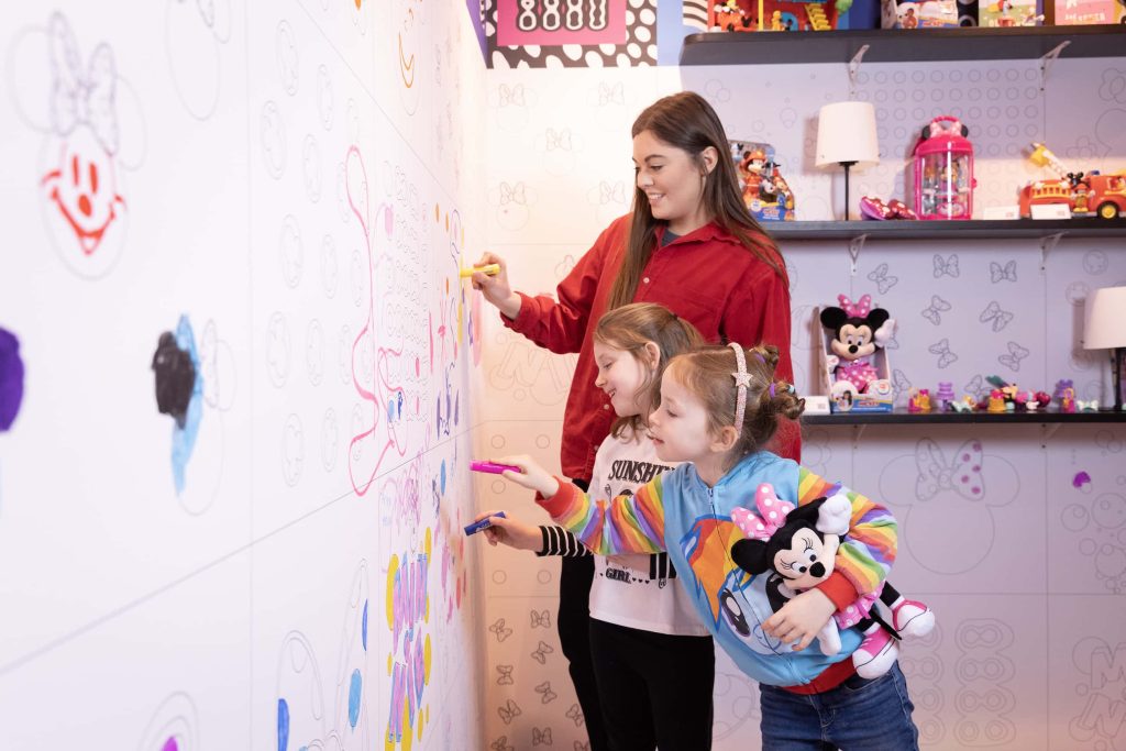 Emily Blackham and Emilia Kramer with Artist Coco Lom at the opening of Disney’s ‘Wonder-ful Playhouse’ pop-up in central London, marking the launch of global initiative ‘The Wonder of Play’, which draws on Disney’s 100-year legacy, to inspire and encourage families to play together more. Picture credit: Matt Alexander/PA Wire