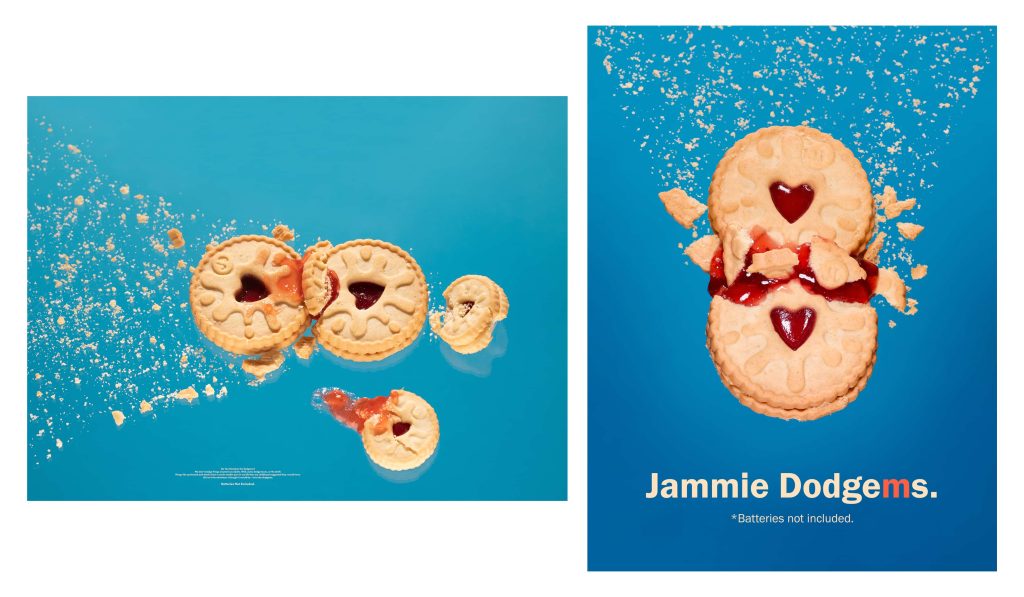 Photography work by student Joey Rolph. Two jammy dodgers have crashed into each other, with jam and crumbs spilling out. The background is blue, with 'Jammy Dodgems' written in white type.