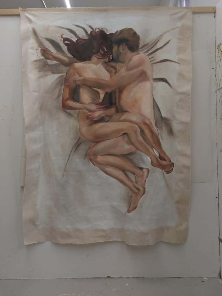 Painting of a naked couple embracing and kissing on a white sheet. The painting hangs loosely from the wall, so creases can be seen in the canvas.