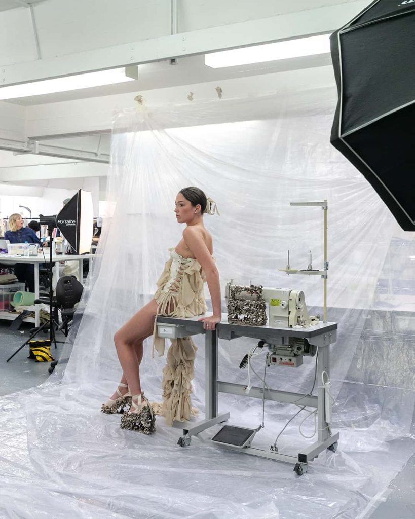 A photo of 'behind the scenes' of a fashion photoshoot where 3rd year BA (Hons) Fashion students are showcasing their end of year outfits ready for Graduate Fashion Week.