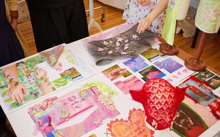 BA (Hons) Textile Design student work laid out on a table at the Textile Design Industry Awards