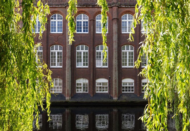 A photo of St. Georges windows and the River Wensum.