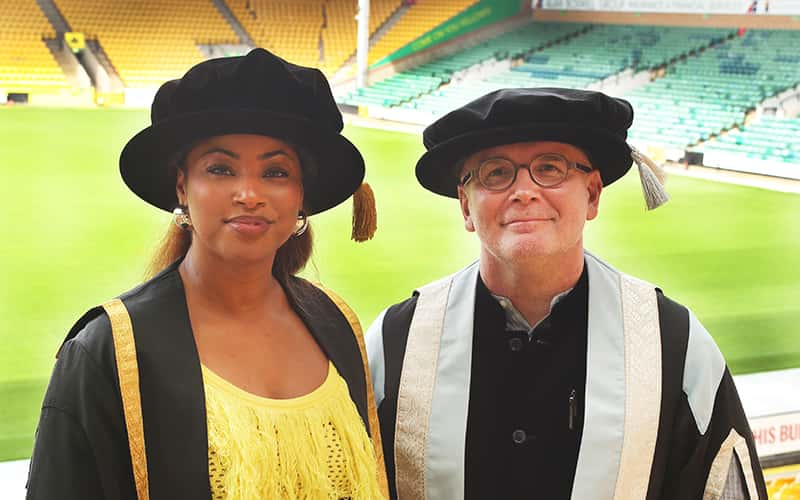 Jay-Ann Lopez with Professor Simon Ofield-Kerr at a Norwich University of the Arts graduation ceremony