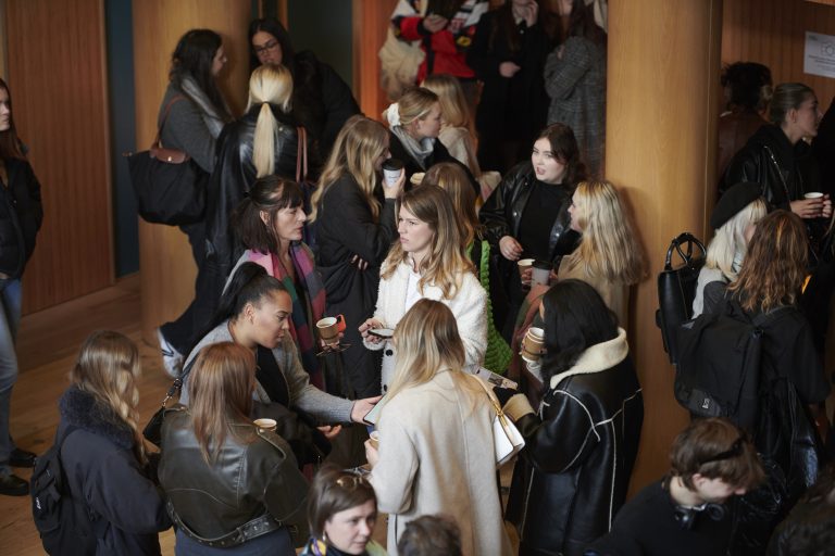 A photo of people talking and networking at the Digital Fashion Symposium in Duke Street Riverside.