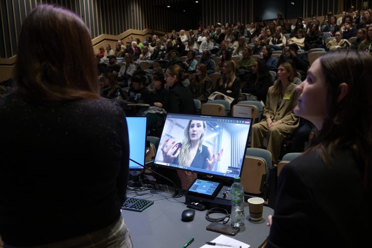 A photo from the Digital Fashion Symposium where Dr Giovanna Graziosi Casimiro is presenting to a large audience in Duke Street Riverside lecture theatre.