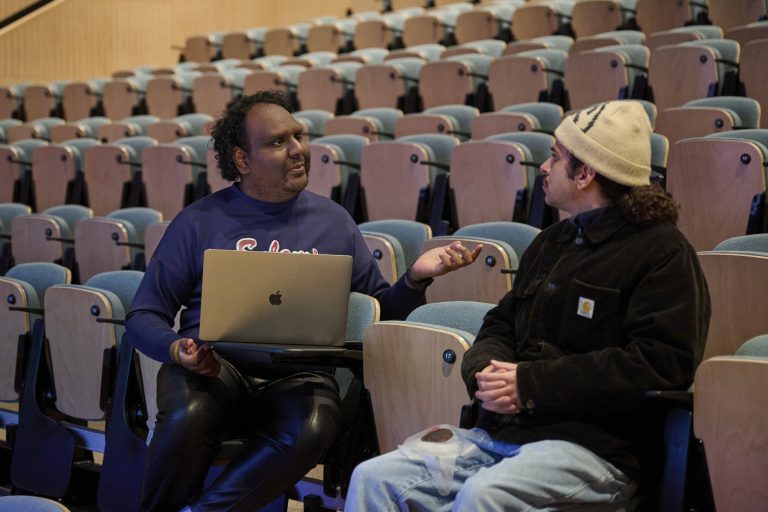 A photo of Dan Hastings-Narayanin, Deputy Foresight Editor LS:N Global, The Future Laboratory, sat down and talking to a student.