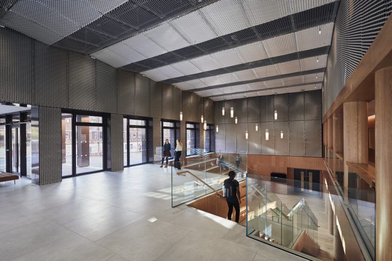 View of foyer space with students moving around.