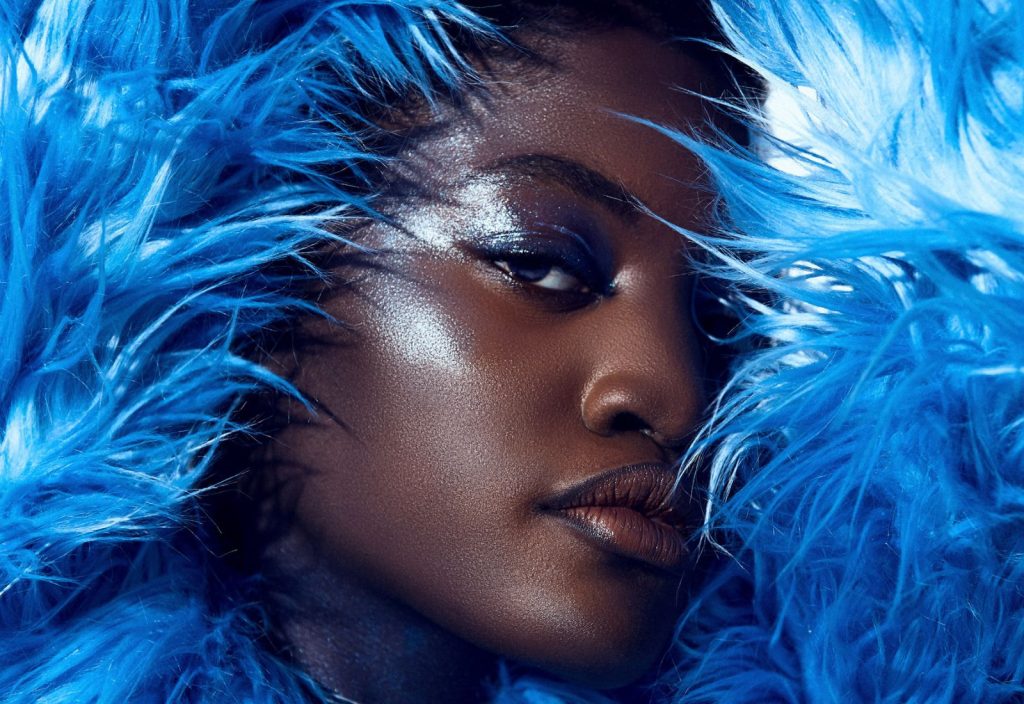 Beyond The Frame. Side profile of a Women surrounded in feathers