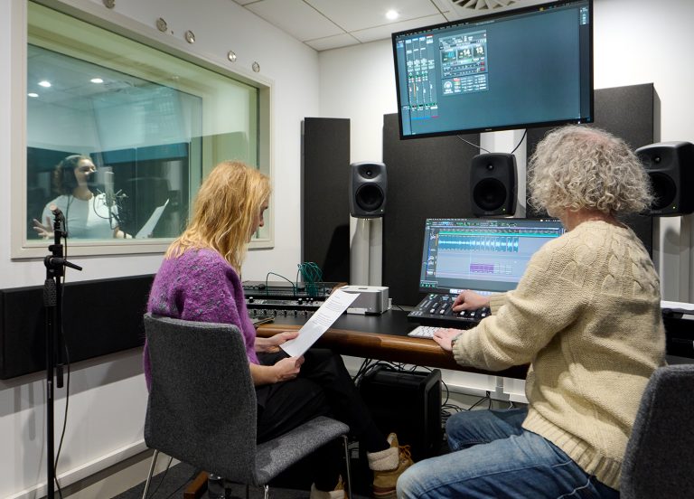 A student working in a sound studio at Norwich University of the Arts