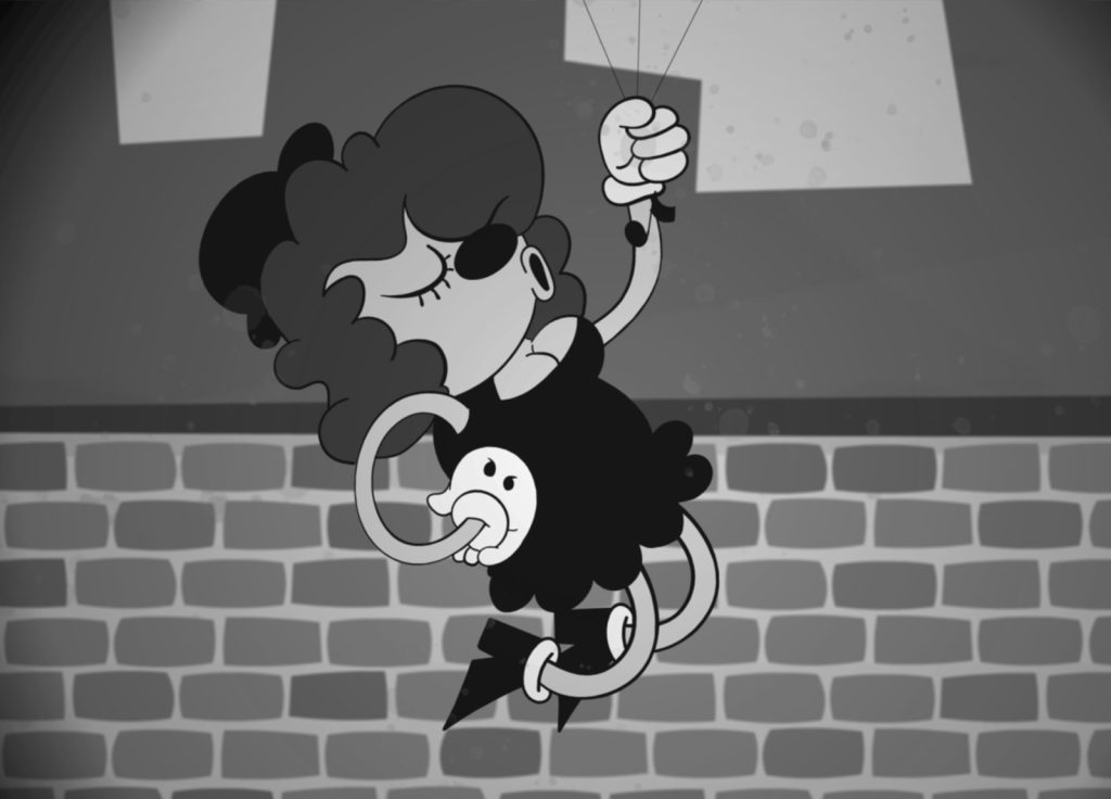 A black-and-white cartoon image depicts a character with curly hair, gloves, and a dress maneuvering strings attached to a cheerful-looking marionette. The background shows a brick wall with abstract shapes above it.