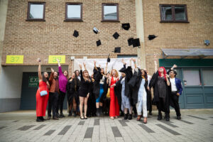 Graduating students throwing hats in the air