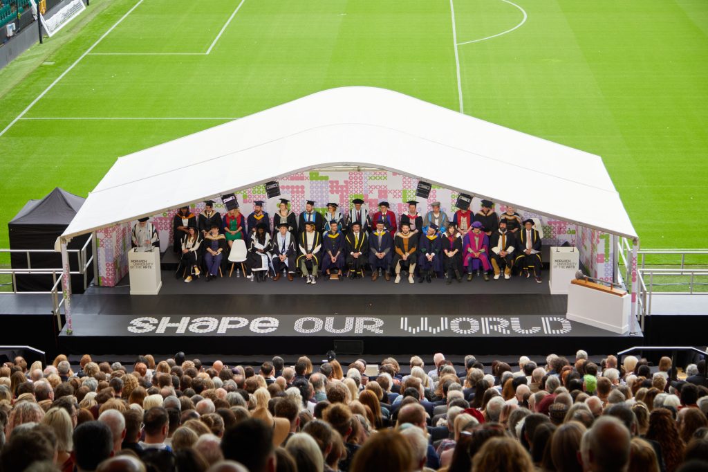 Graduation ceremony, 2024, Norwich Football Ground. View of the stage from the stadium.