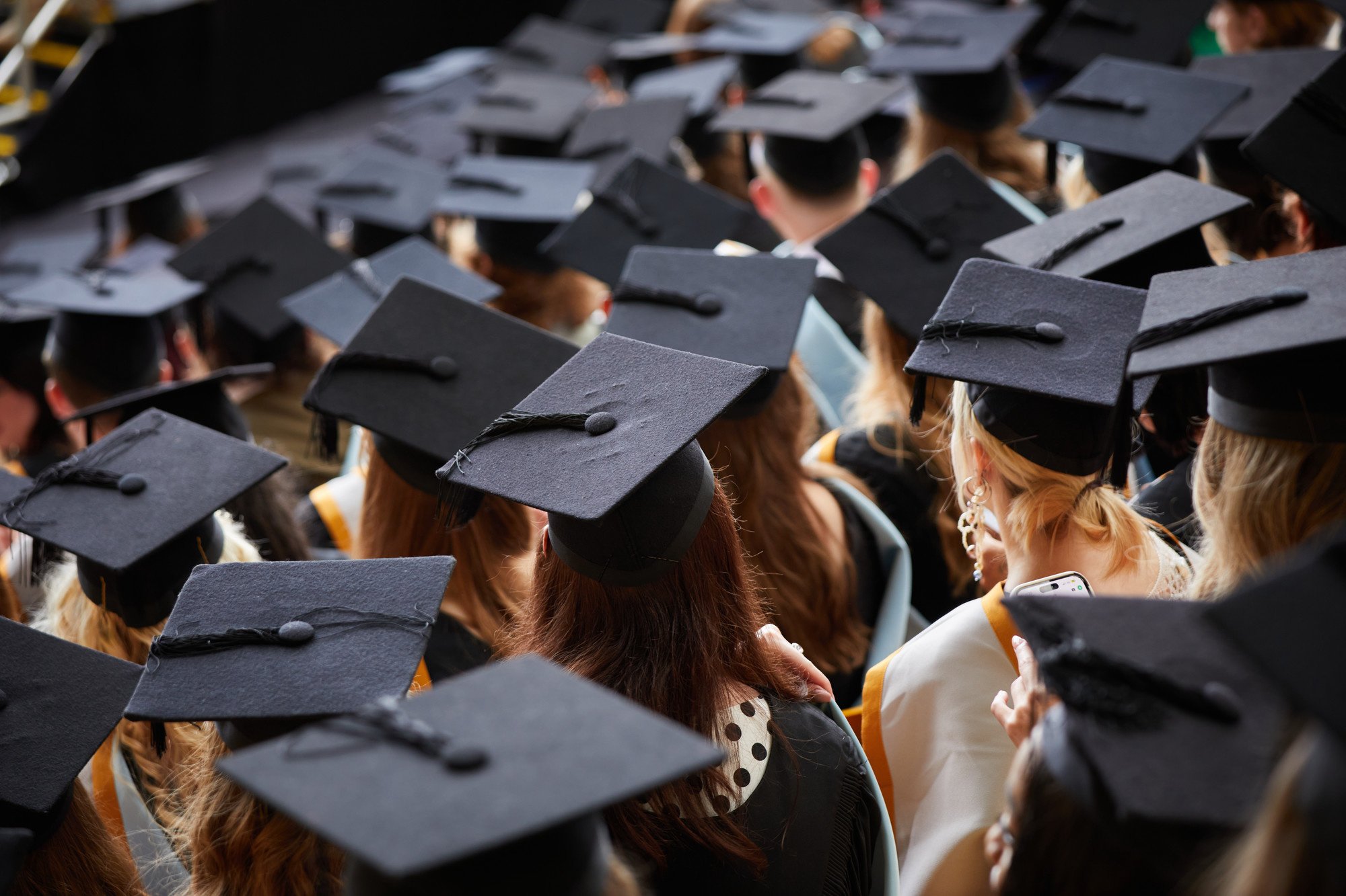 lots of graduating students wearing hats
