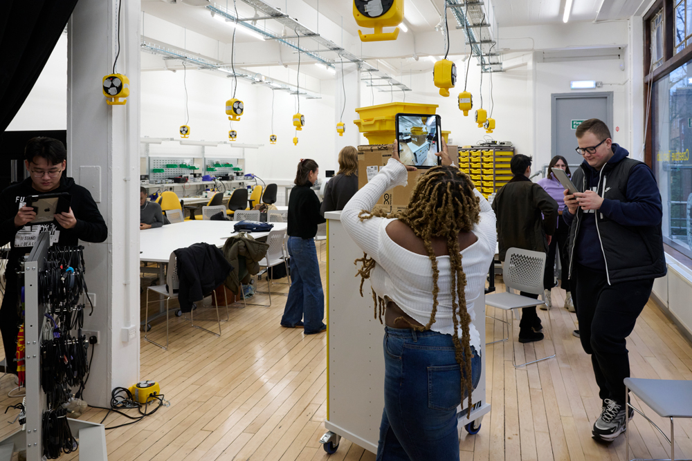 A photo of students using iPads to digitally scan objects in the Creative Tech Lab studio