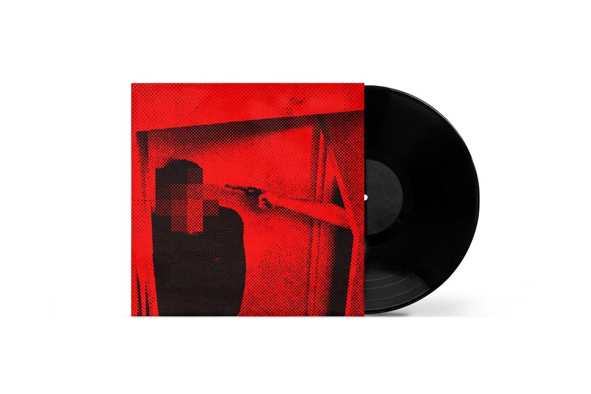 A vinyl record partially in its sleeve; the sleeve is red with a grainy image of a blurry figure and an arm pointing a gun at them. The overall design is stark and graphic.