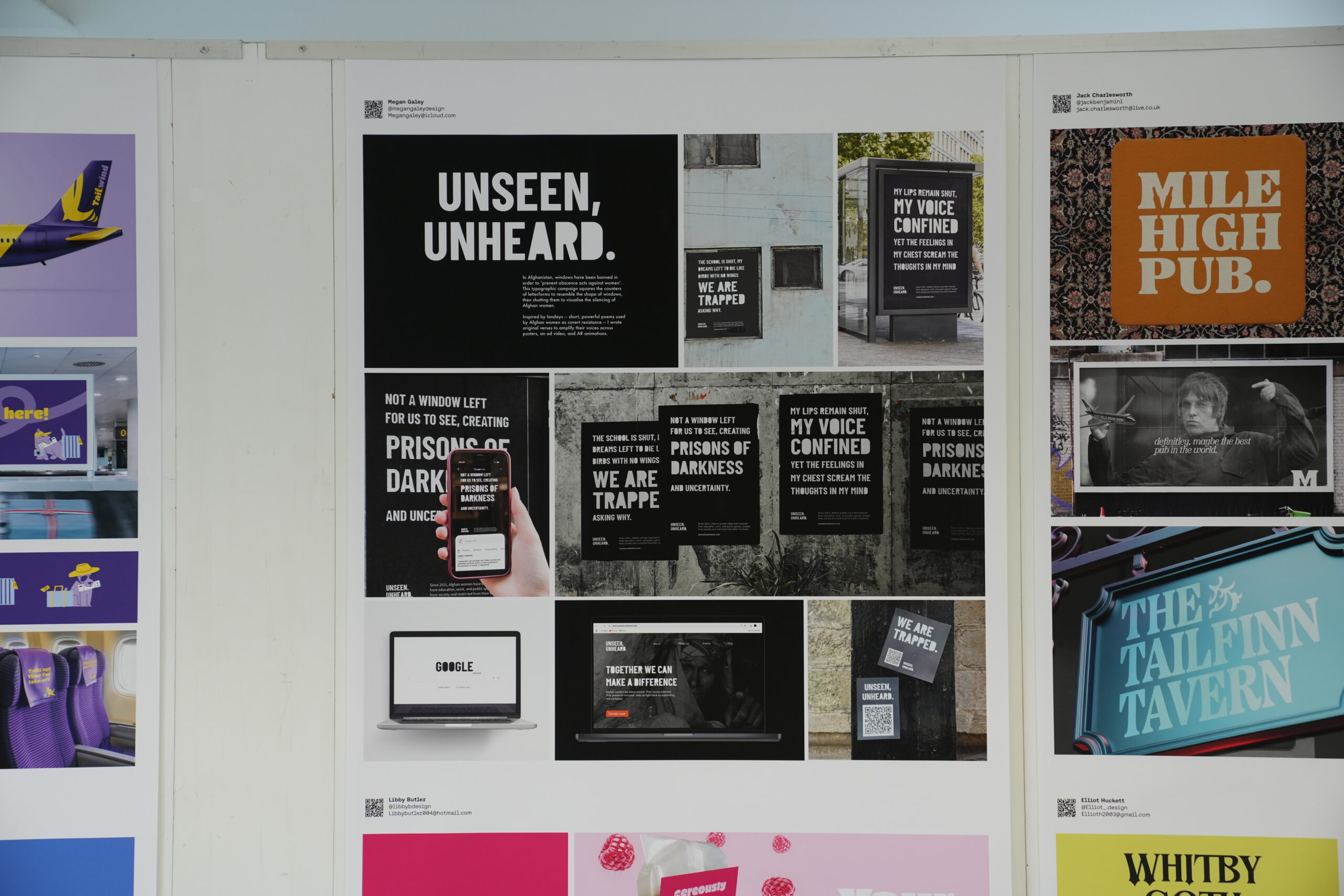 A display board shows posters and advertisements, including prominent black-and-white designs with bold text that reads 'UNSEEN, UNHEARD.'