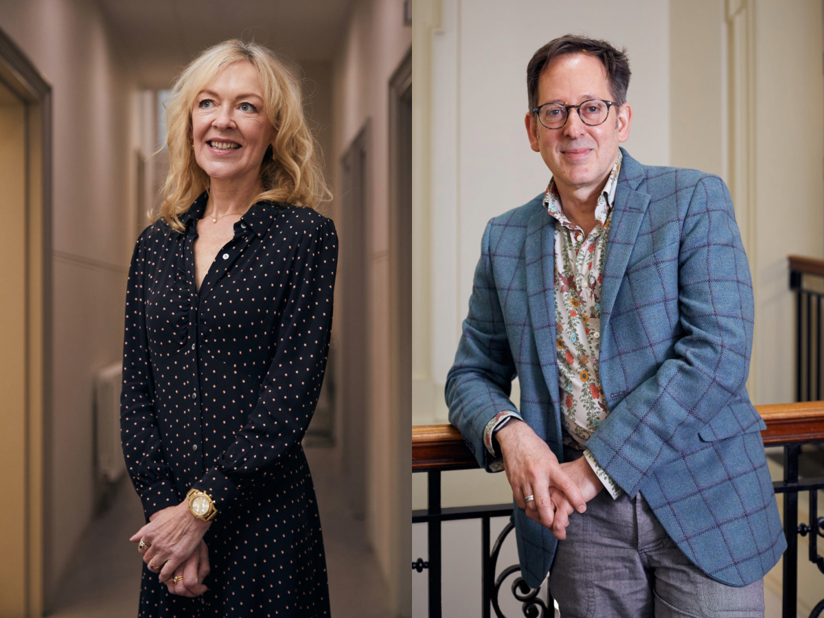 A woman in a black polka-dot dress stands smiling in a hallway, while a man in glasses and a blue plaid jacket leans on a railing indoors, both posing for portraits.